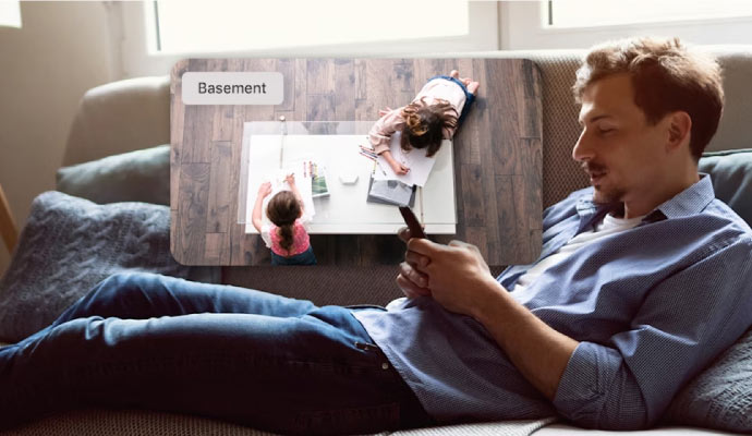 a person monitoring home on his smartphone