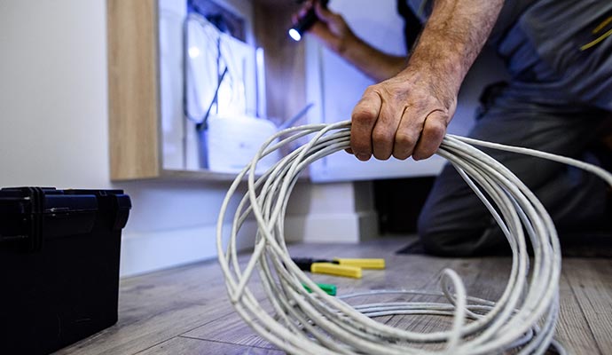 Person installing network cabling